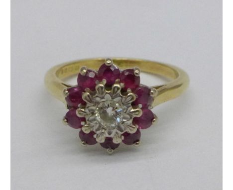 An 18ct gold, ruby and diamond cluster ring, 4.3g, M