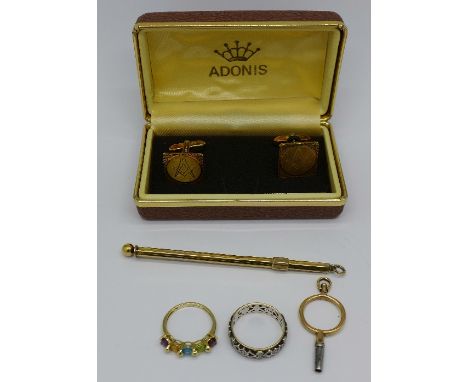 A 9ct gold stone set ring, a 9ct gold and silver ring, a sterling swizzle stick, a yellow metal watch key and a pair of rolle