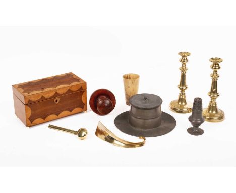 An interesting collection of sundries, to include a brass shoehorn, a pair of brass candle sticks, a brass scribes pen holder