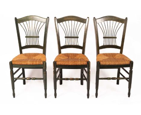 A set of three green stained kitchen chairs with rush seatsGood condition with light scratches and finish wear. Rush seats in