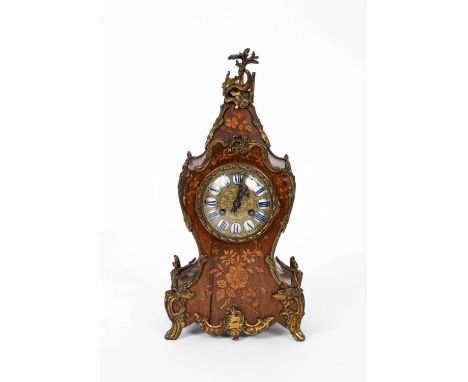 A French inlaid marquetry mantel clock, the gilt embossed dial with enamel numeral reserves, striking movement, numbered 2524
