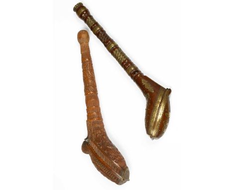 Two wooden carved pipe holders, 19th Century, one with brass mounts, 22.5cm long approx.Brass mount loose near the clasp, oth