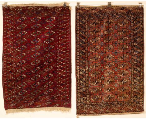 Two Tekke rugs West Turkestan, one with a pale brick red field with three columns of ten quartered Tekke guls, framed by a co