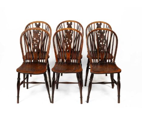 A set of six Windsor wheel back chairs, 90cm high all over wear and scuffs, scratches commensurate with age and use. The more