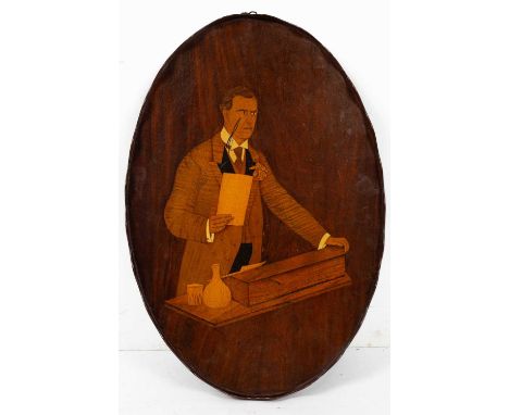 A George III style mahogany tray the oval tray with a serpentine gallery and inlaid with a portrait of Joseph Chamberlain, 40