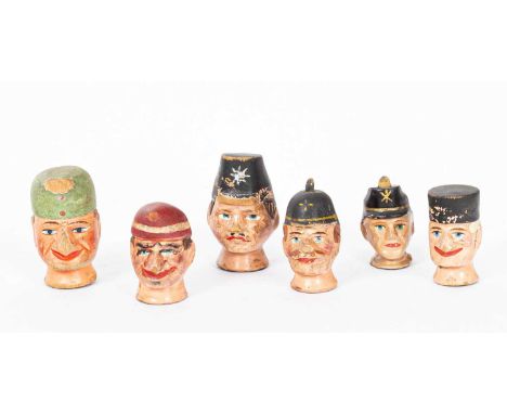 Six Austrian painted and decorated carved wood puppet heads, two of punch and four gendarmesHeight of the tallest 10cm extra 