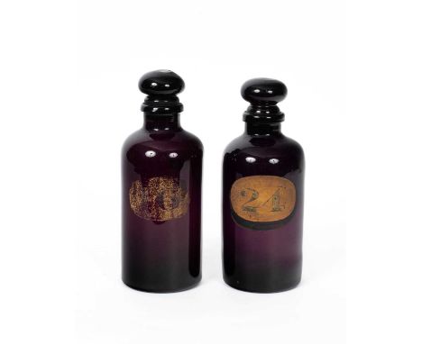 A pair of 19th Century amethyst glass apothecary's bottles and stoppers numbered 16 and 24 respectively, 30cm highI cannot se