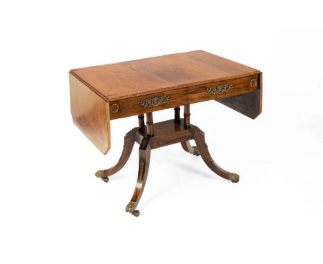 A Regency rosewood and brass inlaid sofa table fitted with two frieze drawers to one side, gilt metal mounts throughout, 148.