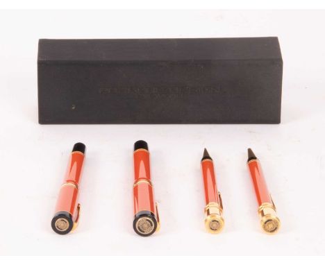 A Parker Duofold 18ct gold nib fountain pen together with two matching biros and a propelling pencil, all in coral coloured c