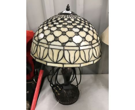A large Tiffany style table lamp