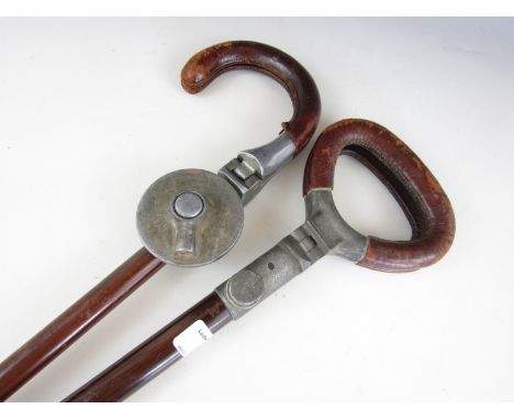 Two vintage shooting sticks