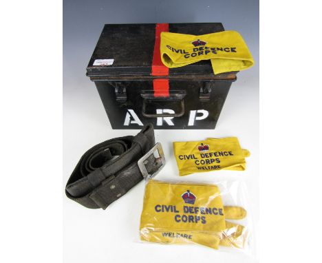 A Second World War ARP first aid tin together with a quantity of Civil Defence Corps brassards and a fire service webbing bel