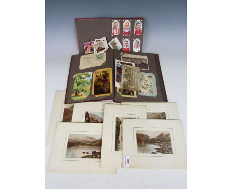 A vintage cigarette album and a postcard album etc