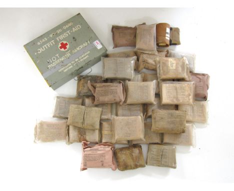 A quantity of Second World War and later field dressing together with a first aid kit