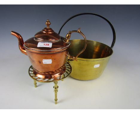 A brass jam pan together with a teapot and trivet