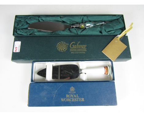 A cased Royal Worcester cake slice together with another by Galway Irish crystal