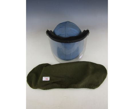 A British Army kevlar helmet, together with a detached visor