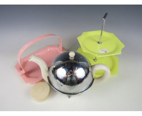 A mid 20th century Lucite cake stand together with basket, a collapsible cup and an insulated teapot