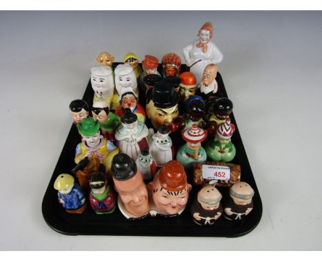 A large quantity of vintage novelty salt and pepper shakers including Laurel and Hardy, Humpty Dumpty and a cowboy wing nodde