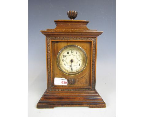 A late 19th century walnut-cased mantel clock with later quartz movement
