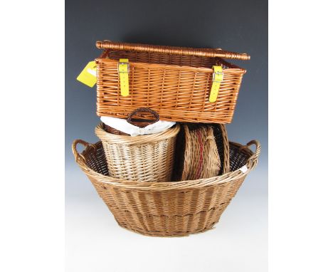 A large wicker basket together with a picnic hamper etc