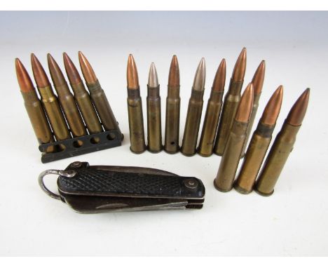 A Second World War British army clasp knife together with a clip and loose inert 303 rifle rounds