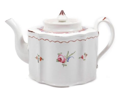 An early 19thC New Hall type teapot and cover, c.1800, decorated with an elaborate border pattern and floral sprays, unmarked