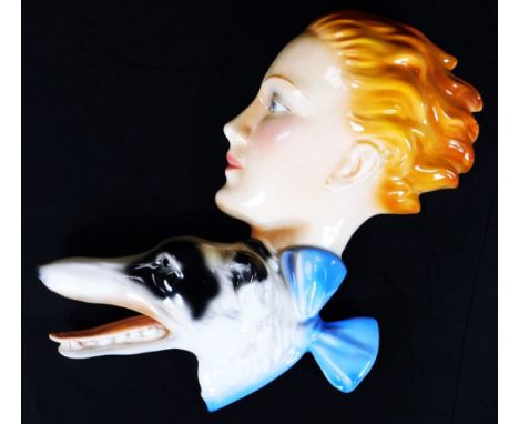 A 1930's Goebel Art Deco wall plaque, lady with borzoi, polychrome decorated, 27cm H.