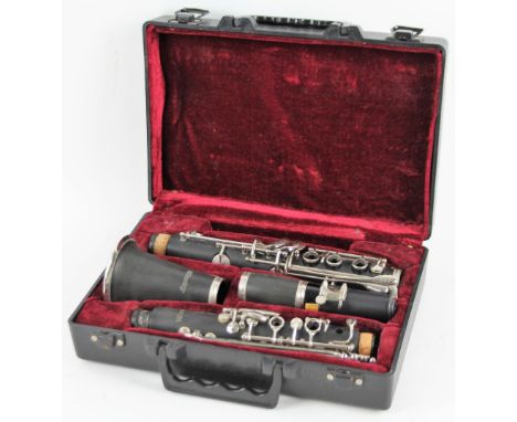 A Blessing four piece clarinet, in fitted case, 31cm W.