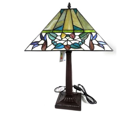 *An as new table lamp, with Tiffany style shade, with a repeat floral pattern predominately in cream, green and yellow, 63cm 