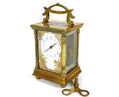A late 19thC brass carriage clock, with ivory coloured 6cm W dial with Arabic numerals, stencilled with gilt flowers and reve