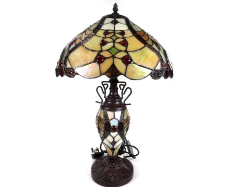 *An as new table lamp, with Tiffany style shade and stem, in floral pattern predominately in cream, green and red, 63cm H.