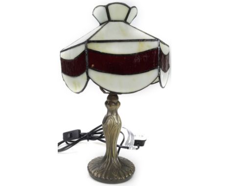 *An as new table lamp, with Tiffany style shade, in cream and red, 34cm H.