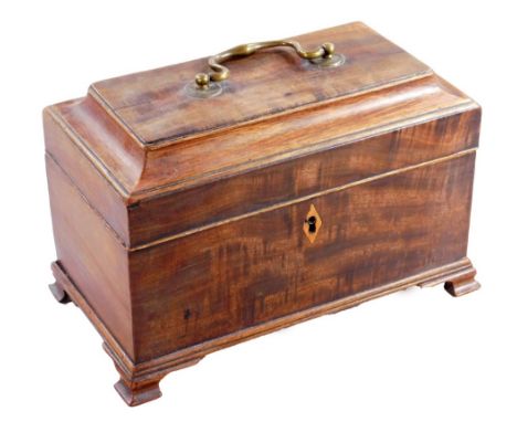 A George III mahogany tea caddy, with brass handle and a part fitted interior, on ogee bracket feet, 18cm H, 24cm W, 13cm D. 