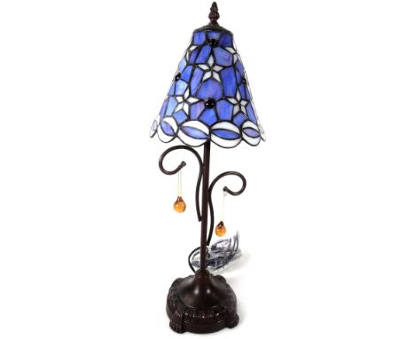 *An as new table lamp, with Tiffany style floral shade, with a repeat star decoration  predominately in blue and cream, with 