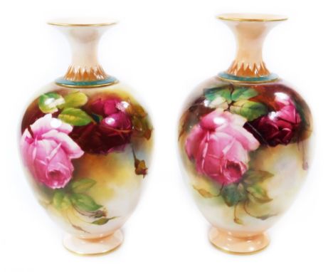 A pair of late 19thC Royal Worcester vases, decorated by Reginald Austin, c.1899, each handpainted with roses, signed R Austi