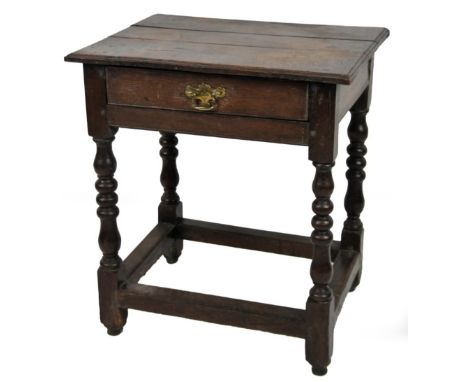 A principally 18thC oak side table, rectangular top raised above a frieze drawer, on baluster barleytwist legs terminating in