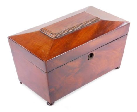 A 19thC mahogany sarcophagus tea caddy,  with nulled decoration and plain interior, 17cm H, 29cm W, 15cm D.
