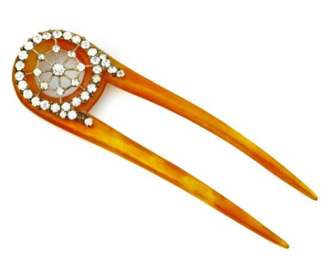 An Edwardian Mantilla comb, with paste design top, with two pins, on orange Bakelite, 11cm H.