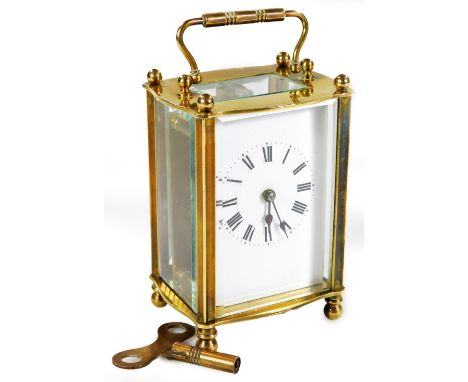 An early 20thC brass carriage clock, the 5.5cm back plate with Roman numeric dial, in a five part glazed case, revealing a si