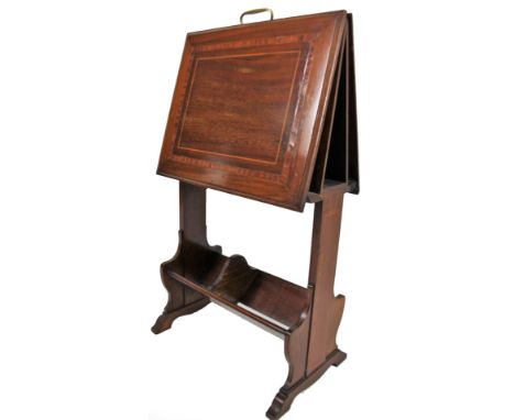 An Edwardian mahogany folio stand, with brass handle, rectangular enclosures, with boxwood stringing and satinwood crossbandi