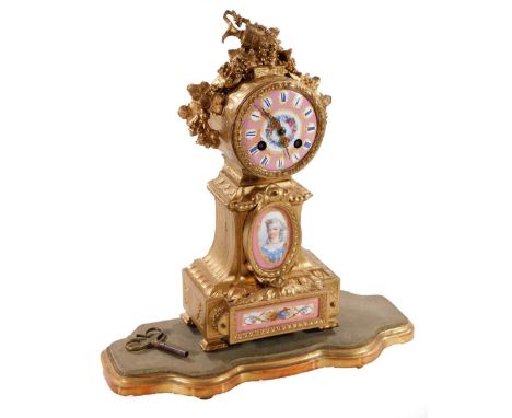 A 19thC French gilt metal mantel clock, with 8cm Dia. Sevres style porcelain dial with Roman numerals, above a further two pa