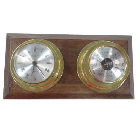 An Anstey Wilson hanging quartz clock and barometer, each in circular cases with 9cm Dia. Roman numeric dial, etc.