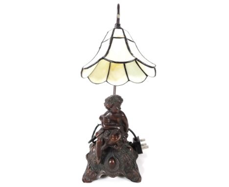 *An as new cherub stem lamp, with Tiffany style floral shade, on shaped stem, 44cm H.