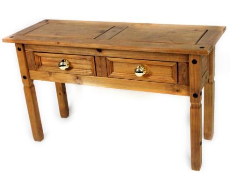 A 20thC pine side table, with rectangular overrun top, raised above two drawers, on block legs, set with studs, 76cm H, 127cm