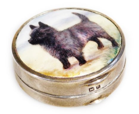 A George V silver and enamel powder compact, by Hamilton &amp; Inches,  the 4cm Dia. lid set with a Cairn terrier, with thumb