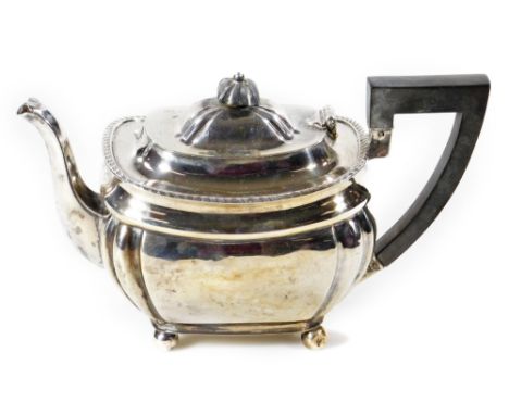 An Edwardian bachelor's teapot, of shaped form, with angular handle, on ball feet, Sheffield 1903, 12cm H, 13oz all in.