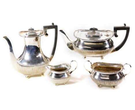 An early 20thC silver four piece coffee service, by William Hutton &amp; Sons, comprising of a coffee pot, 22cm H, teapot, tw