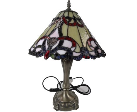 *An as new Tiffany style table lamp, with floral shade predominately in cream and red, 53cm H.