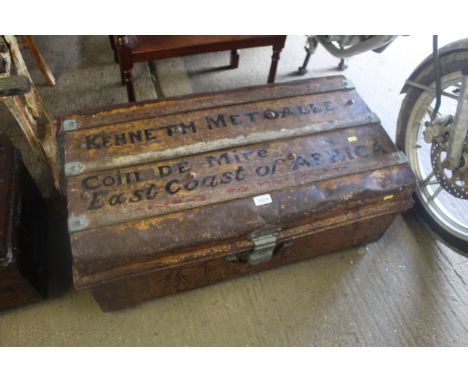 A painted and decorated metal storage trunk 